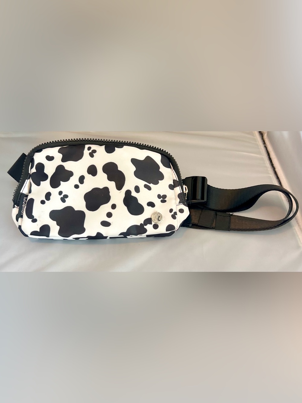 Lululemon Everywhere Belt Bag in a stylish, bold black-and-white cow print